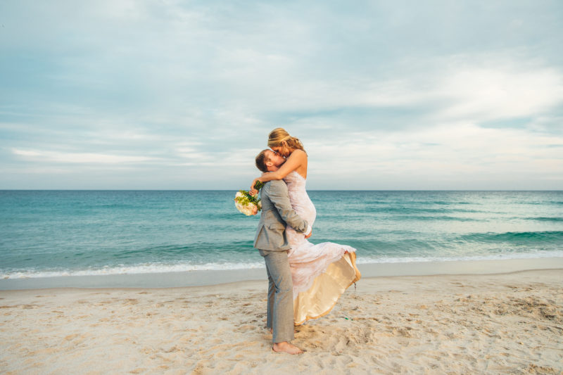 Bride and groom embrace on a Florida Beach during their elopement