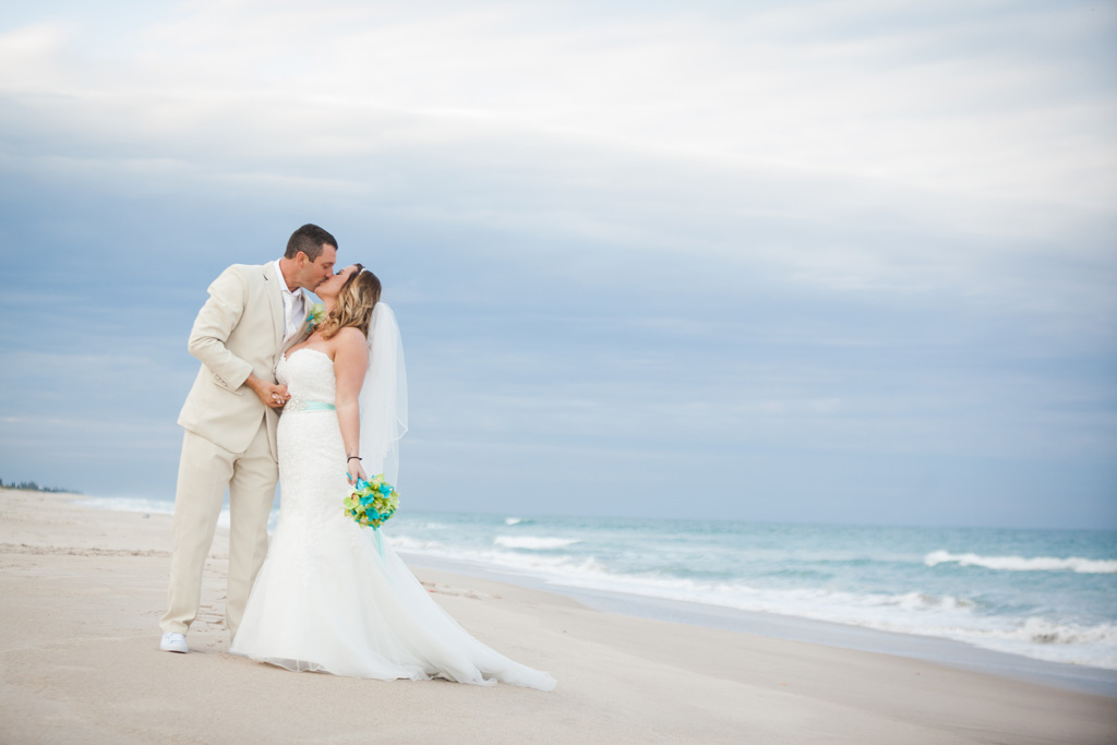 A Fort Pierce Beach Wedding Couple Kissing on the beach