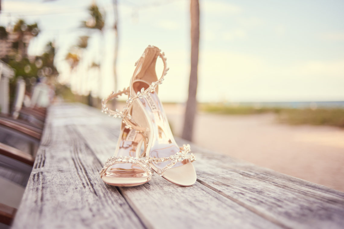 Close-up shot of bridal shoes on the beach - Lauderdale-by-the-Sea