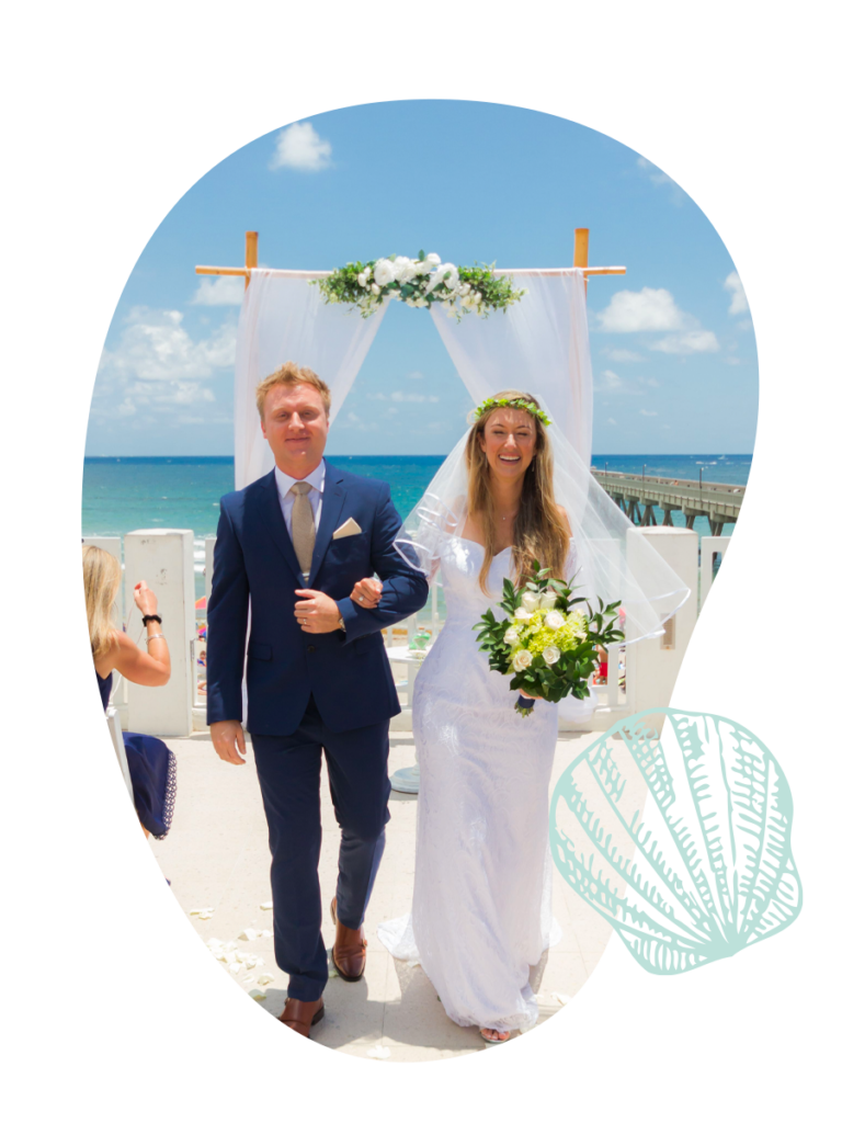 smiling couple, blue water, beach wedding