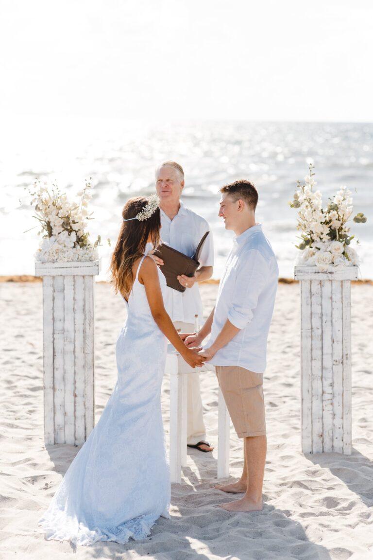 Beach Wedding with 2 pedestals and ivory florals
