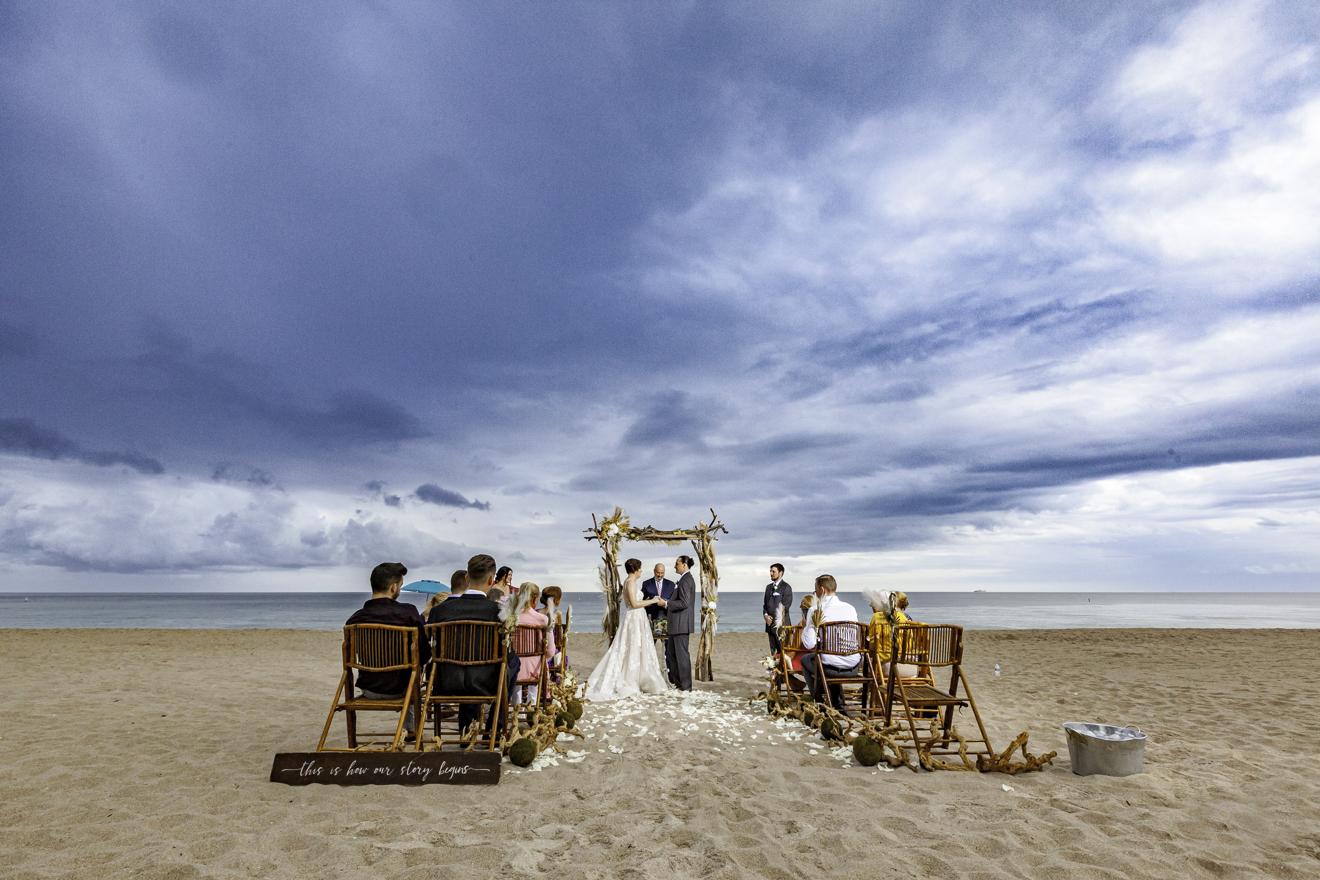 Small Beachfront Wedding in Florida with Guests and Driftwood Accents