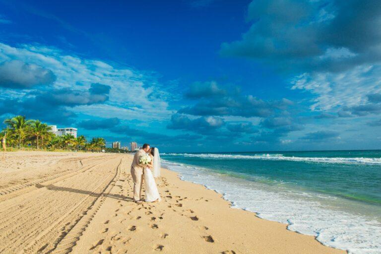 Bride and groom strolling on Fort Lauderdale Beach