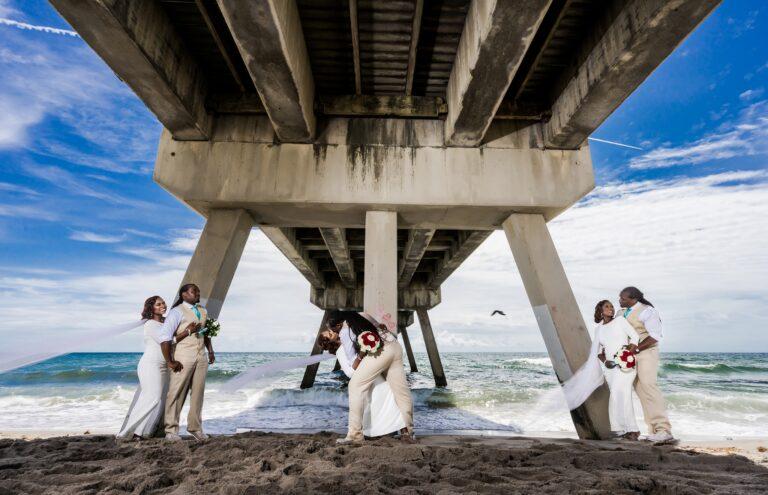 Deerfield FL Beach Wedding Photo on Sand Below Boardwalk